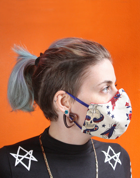 Side view of tattoo patterned fitted face mask