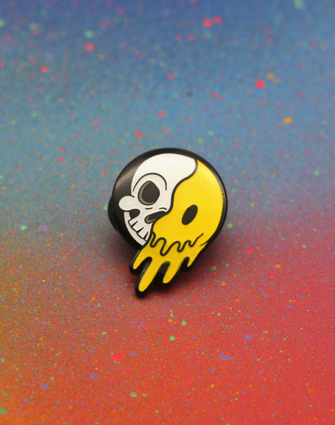 close up of 90s rave skeleton cartoon smiley face designer enamel pin badges
