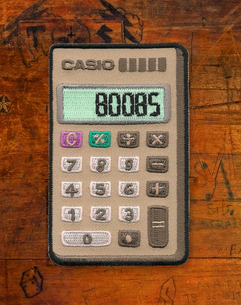 Boobs Casio Calculator (Glow in the Dark) Iron-on Patch by Maxine Abbott | Platypus Streetwear
