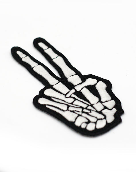 Close up of Skeleton RIP Peace sign goth punk Iron on Embroidered Patch badge