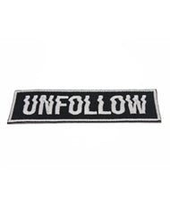 angle shot of glow in the dark unfollow type goth emo punk protest embroidered patches on white
