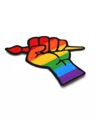 Close up of designer embroidered queer pride with paint brush iron-on patch badge Platypus UK
